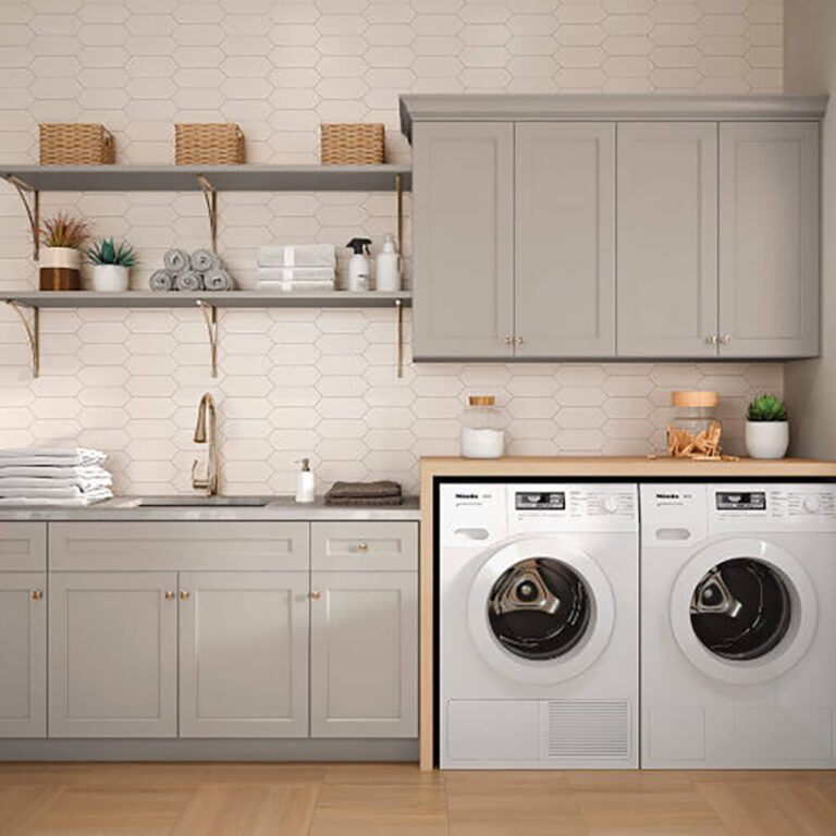 Mantra grey shaker cabinetry in traditional laundry room