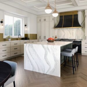 Waterfall island in kitchen with chevron patterned laminate flooring