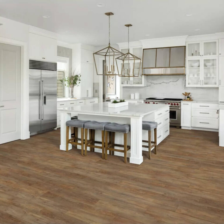 transitional kitchen with mid-tone hard surface flooring and white cabinetry and counters