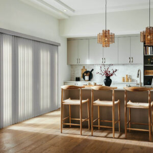 Graber vertical blinds in taupe covering a sliding glass door
