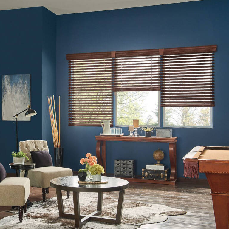 Graber vertical wood blinds in a dark blue lounge
