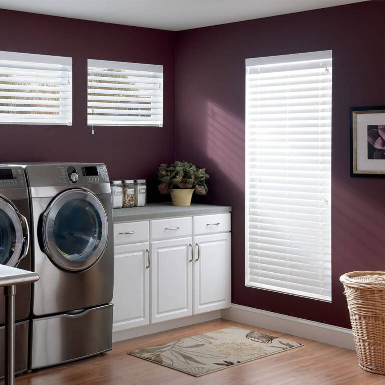 Graber white faux wood blinds in a laundry room